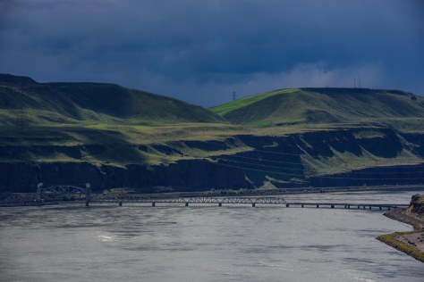 The railroad bridge near Wishram threatened by looming dark clouds
